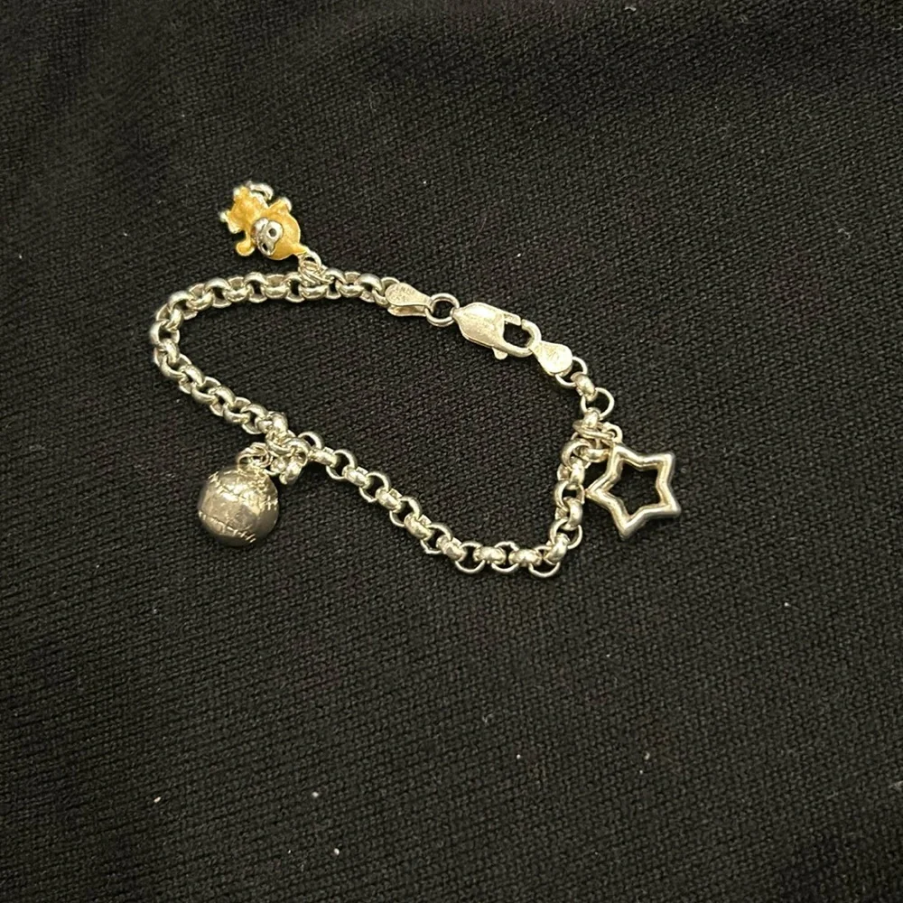 Sterling Silver 3 1/4” Size Wrist Charm Bracelet for Child.  Has  3 Charms. Good